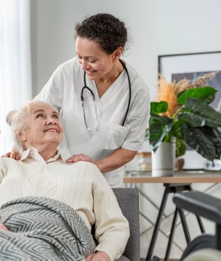 A nurse assisting an elderly patient